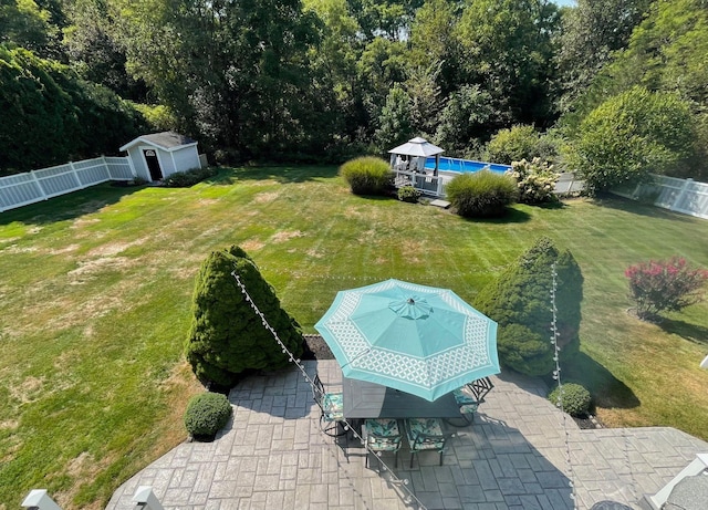 43 Southfield Rd, Baiting Hollow, NY 11933 - fenced backyard featuring a patio area, a shed, and outdoor dining space