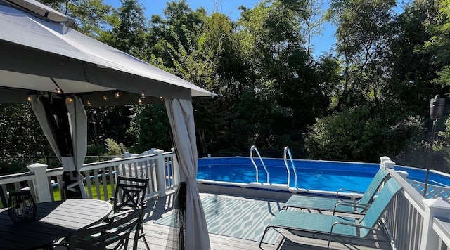 43 Southfield Rd, Baiting Hollow, NY 11933 - outdoor pool with a gazebo and view of wooded area