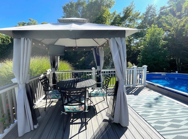 43 Southfield Rd, Baiting Hollow, NY 11933 - deck with a gazebo, an outdoor pool, and outdoor dining space