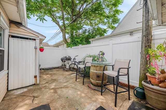 25 December Walk, Long Beach, NY 11561 - fenced backyard with a patio, area for grilling, and outdoor dining space