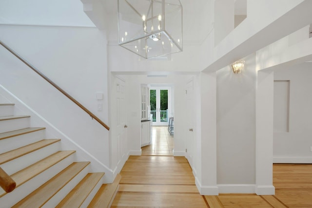 31 Pierce Dr, Pleasantville, NY 10570 - foyer featuring a chandelier, light wood finished floors, stairway, and a high ceiling