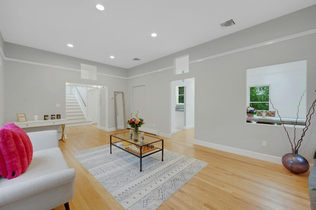 31 Pierce Dr, Pleasantville, NY 10570 - living room featuring stairway, light wood-type flooring, and recessed lighting