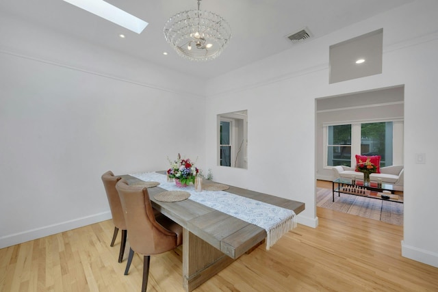 31 Pierce Dr, Pleasantville, NY 10570 - dining space with a chandelier, a skylight, light wood finished floors, and recessed lighting