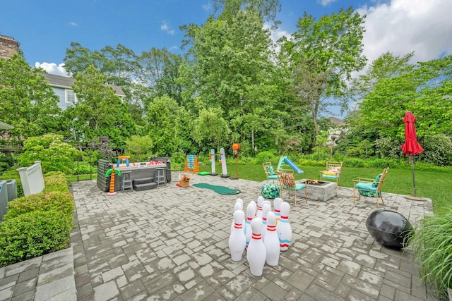31 Pierce Dr, Pleasantville, NY 10570 - view of patio with an outdoor fire pit and view of scattered trees