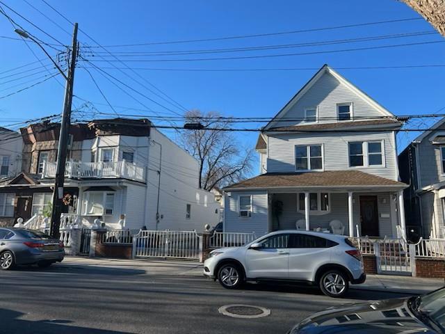 8025 88th Rd, Woodhaven, NY 11421 - view of front facade with a porch