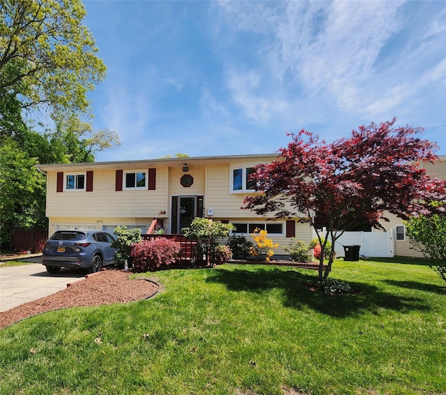 373 Commack Rd, Islip, NY 11751 - split foyer home featuring driveway and a garage