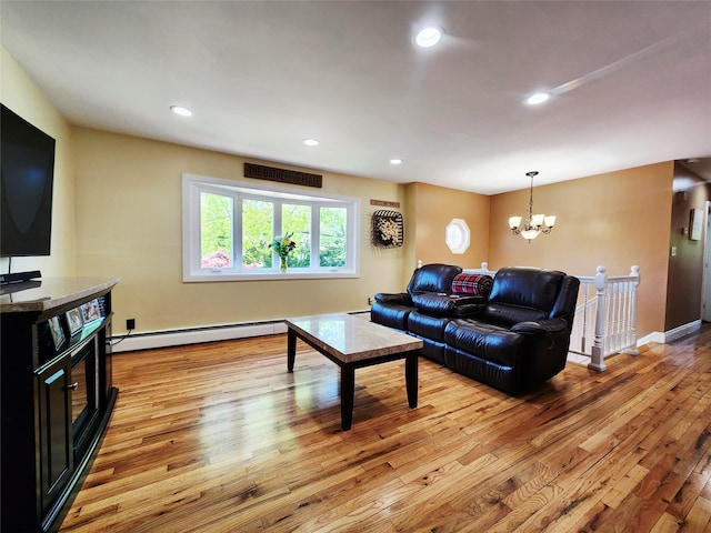373 Commack Rd, Islip, NY 11751 - living area with baseboard heating, light wood-type flooring, a chandelier, and recessed lighting