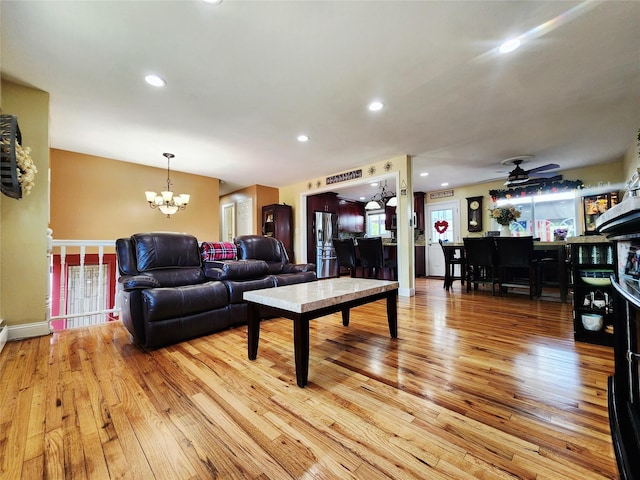 373 Commack Rd, Islip, NY 11751 - living room with a chandelier, light wood-style flooring, a ceiling fan, and recessed lighting
