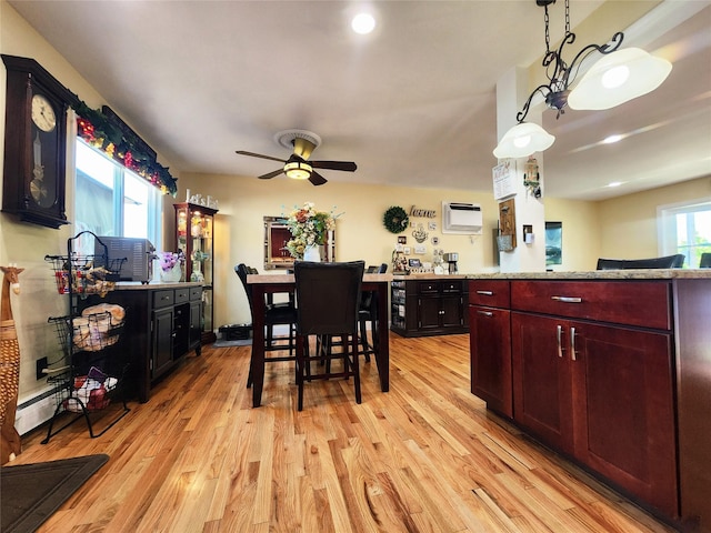 373 Commack Rd, Islip, NY 11751 - dining room with light wood-style floors, a ceiling fan, a wall mounted AC, a baseboard radiator, and recessed lighting