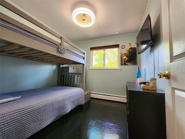 373 Commack Rd, Islip, NY 11751 - bedroom with a baseboard heating unit and wood-type flooring