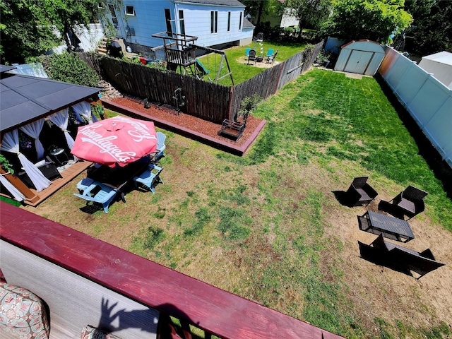 373 Commack Rd, Islip, NY 11751 - fenced backyard featuring a storage unit