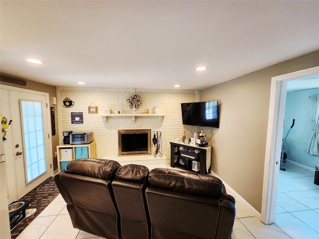 373 Commack Rd, Islip, NY 11751 - living area with light tile patterned floors, a fireplace, and recessed lighting