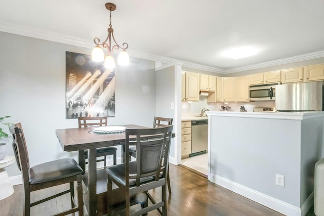 13 Scenic Dr Unit D, Croton-On-Hudson, NY 10520 - dining room featuring a chandelier, crown molding, and wood finished floors