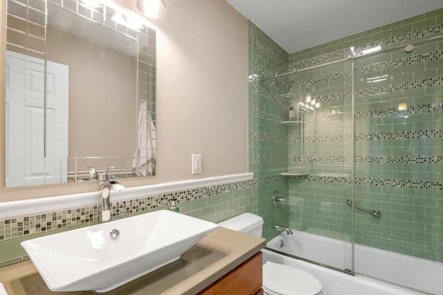 13 Scenic Dr Unit D, Croton-On-Hudson, NY 10520 - bathroom with tile walls, shower / bath combination with glass door, vanity, and a wainscoted wall