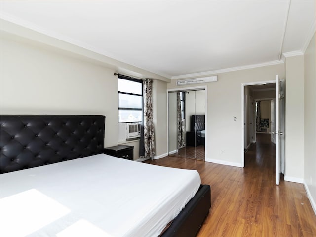 61-25 98th St Unit 2H, Rego Park, NY 11374 - bedroom with ornamental molding, a closet, wood finished floors, and cooling unit
