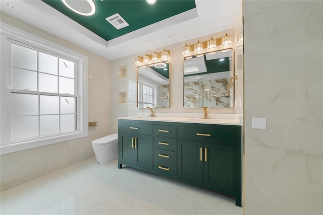 71 Cedar St, Hicksville, NY 11801 - full bathroom featuring a raised ceiling, double vanity, and a marble finish shower