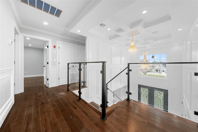 71 Cedar St, Hicksville, NY 11801 - hall featuring a decorative wall, a chandelier, ornamental molding, wood finished floors, and an upstairs landing