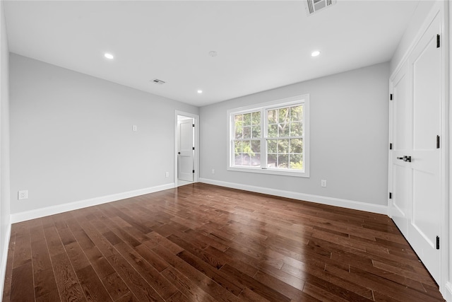 71 Cedar St, Hicksville, NY 11801 - spare room with dark wood-type flooring and recessed lighting