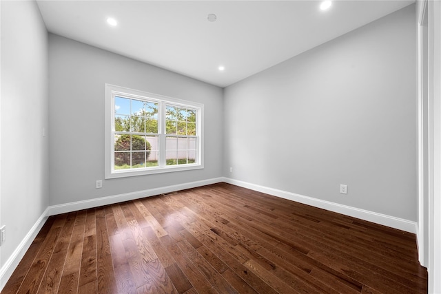 71 Cedar St, Hicksville, NY 11801 - spare room with dark wood-type flooring and recessed lighting
