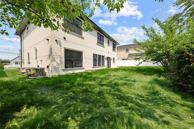 71 Cedar St, Hicksville, NY 11801 - rear view of property with stucco siding