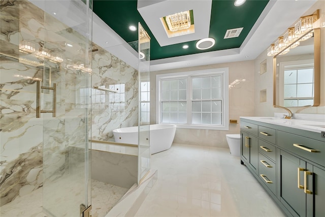71 Cedar St, Hicksville, NY 11801 - full bathroom featuring vanity, a skylight, a marble finish shower, a freestanding tub, and healthy amount of natural light