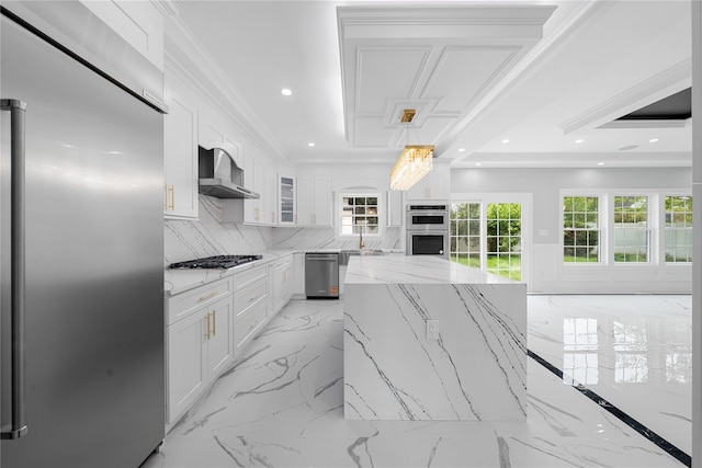 71 Cedar St, Hicksville, NY 11801 - kitchen with appliances with stainless steel finishes, wall chimney exhaust hood, light marble finish flooring, white cabinetry, and backsplash