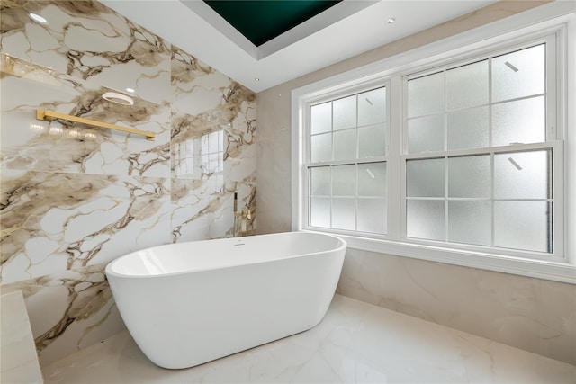 71 Cedar St, Hicksville, NY 11801 - bathroom featuring a soaking tub and marble tiled floors