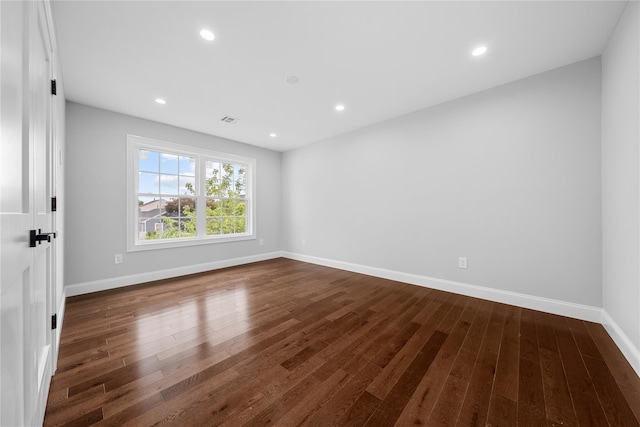 71 Cedar St, Hicksville, NY 11801 - empty room featuring dark wood finished floors and recessed lighting