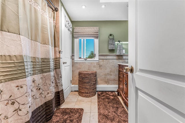99 Stone Ln, Levittown, NY 11756 - bathroom with tile walls, tile patterned flooring, recessed lighting, wainscoting, and a baseboard heating unit