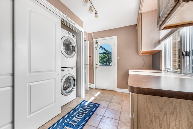 99 Stone Ln, Levittown, NY 11756 - washroom featuring estacked washer and dryer and baseboards