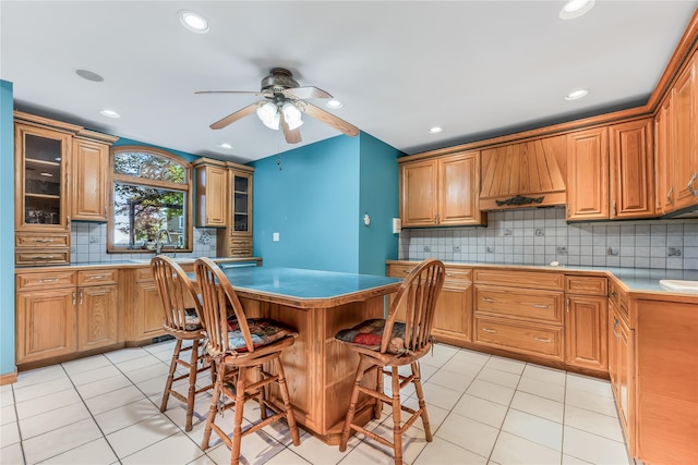 99 Stone Ln, Levittown, NY 11756 - kitchen featuring custom exhaust hood, a ceiling fan, tasteful backsplash, light tile patterned flooring, and recessed lighting