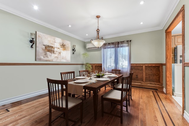 99 Stone Ln, Levittown, NY 11756 - dining room featuring an AC wall unit, wood finished floors, ornamental molding, and recessed lighting