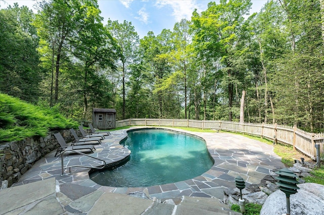 35 David Rd, Somers, NY 10589 - view of pool featuring a patio, a storage shed, and a fenced backyard