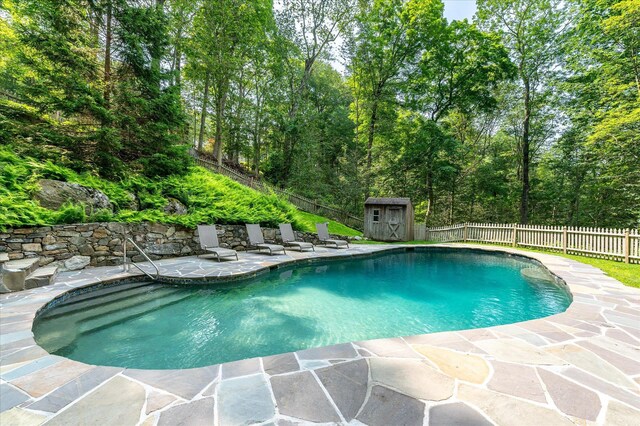 35 David Rd, Somers, NY 10589 - view of swimming pool featuring a patio area, a shed, and a fenced backyard