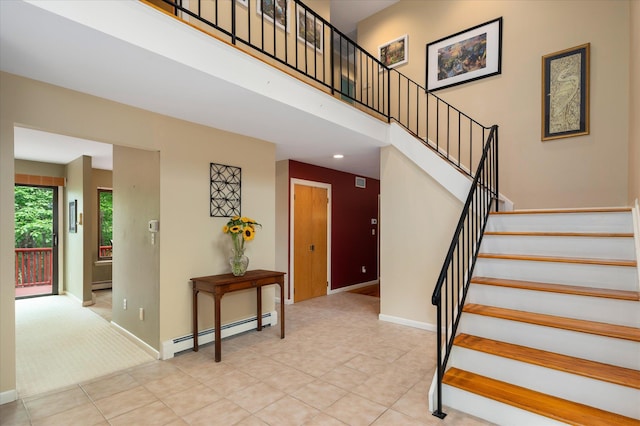 35 David Rd, Somers, NY 10589 - stairway featuring baseboard heating, a high ceiling, and tile patterned floors