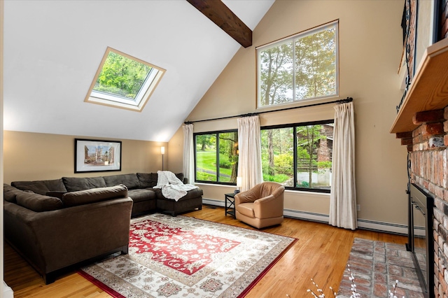 35 David Rd, Somers, NY 10589 - living area featuring a baseboard radiator, a fireplace, wood finished floors, a skylight, and high vaulted ceiling