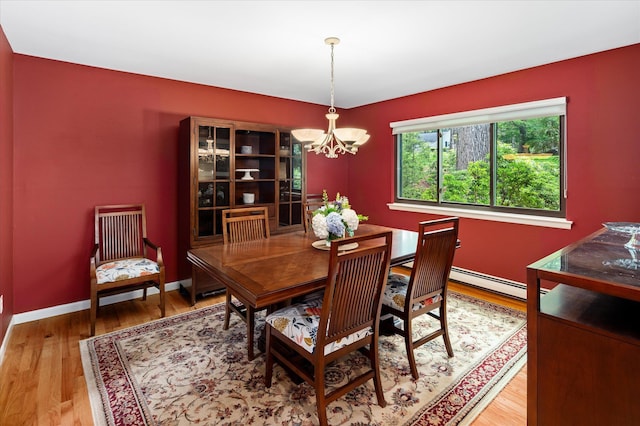 35 David Rd, Somers, NY 10589 - dining room featuring a chandelier, wood finished floors, and a baseboard radiator