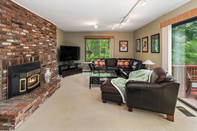 35 David Rd, Somers, NY 10589 - living area with carpet, rail lighting, and baseboard heating