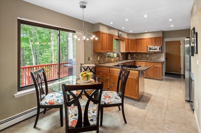 35 David Rd, Somers, NY 10589 - kitchen featuring stainless steel microwave, brown cabinets, tasteful backsplash, plenty of natural light, and recessed lighting