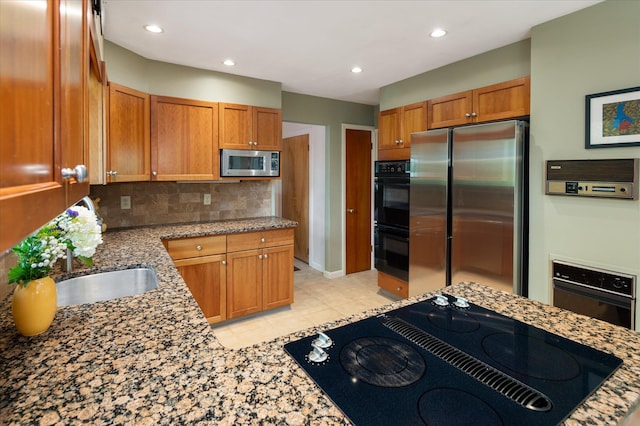35 David Rd, Somers, NY 10589 - kitchen featuring black appliances, backsplash, light tile patterned floors, light stone countertops, and brown cabinetry
