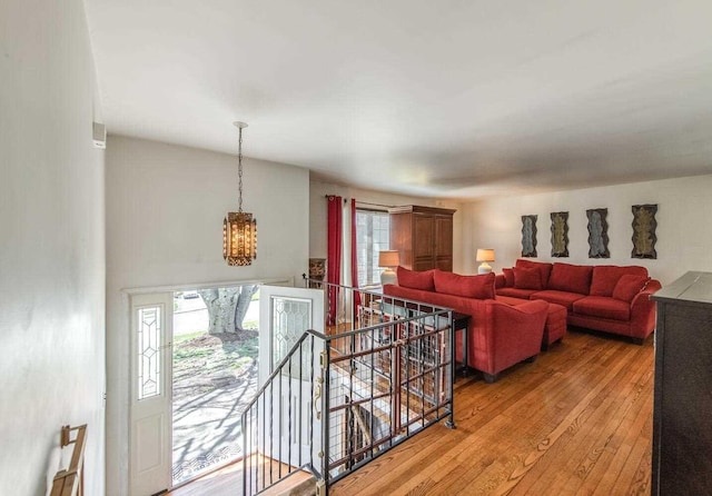 12 Dwyer Ln, Wappingers Falls, NY 12590 - living area with a chandelier and light wood-style flooring