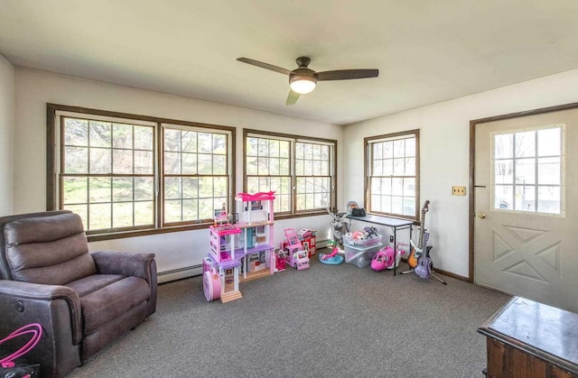 12 Dwyer Ln, Wappingers Falls, NY 12590 - playroom with carpet floors, ceiling fan, and a baseboard heating unit