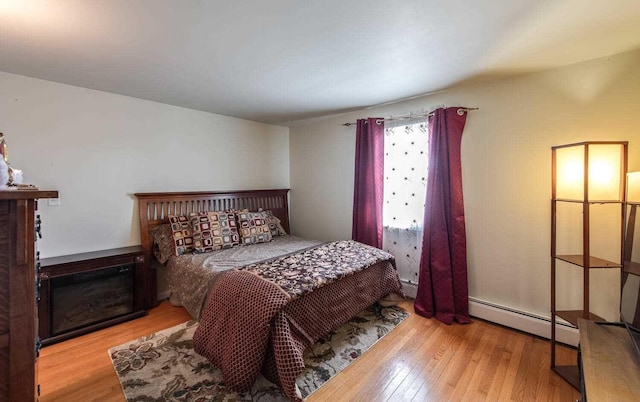 12 Dwyer Ln, Wappingers Falls, NY 12590 - bedroom with baseboard heating and wood finished floors
