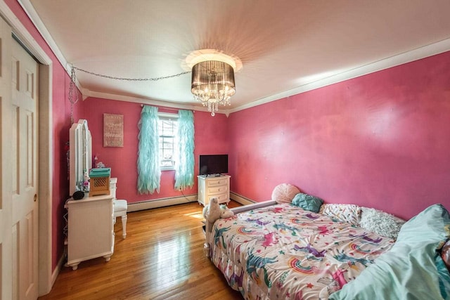 12 Dwyer Ln, Wappingers Falls, NY 12590 - bedroom featuring a baseboard heating unit, wood-type flooring, crown molding, and a chandelier