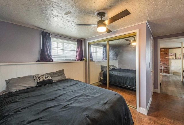 12 Dwyer Ln, Wappingers Falls, NY 12590 - bedroom featuring wood finished floors, a closet, a textured ceiling, ornamental molding, and ceiling fan