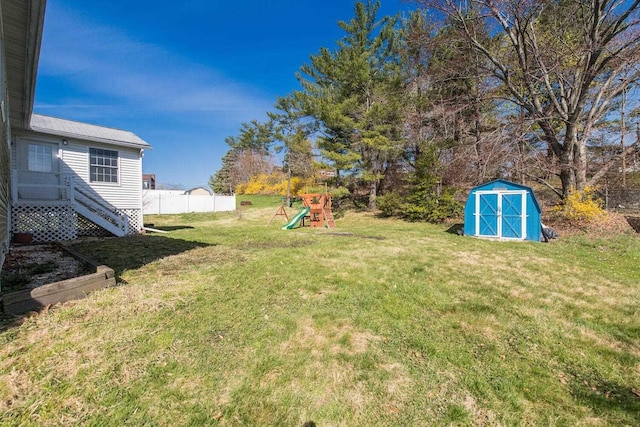 12 Dwyer Ln, Wappingers Falls, NY 12590 - view of yard featuring a storage shed and a playground
