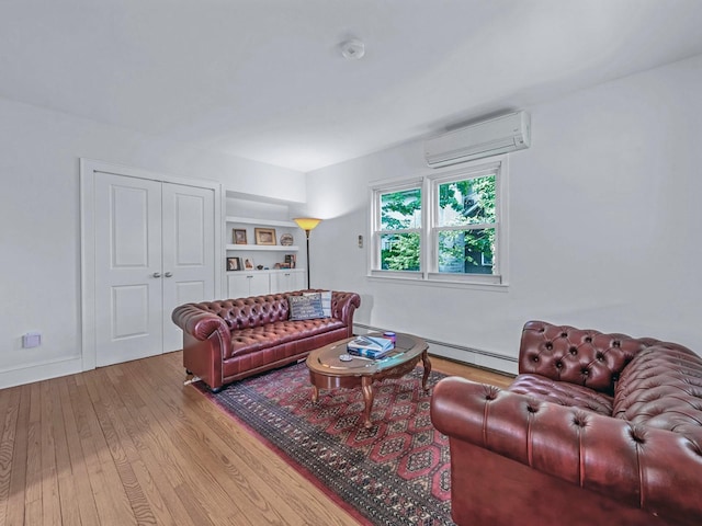 20 Fairmount Blvd, Garden City, NY 11530 - living room featuring a wall unit AC, wood finished floors, baseboard heating, and built in shelves