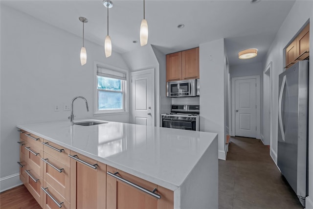 20 Fairmount Blvd, Garden City, NY 11530 - kitchen with stainless steel appliances, a peninsula, decorative light fixtures, light countertops, and brown cabinetry
