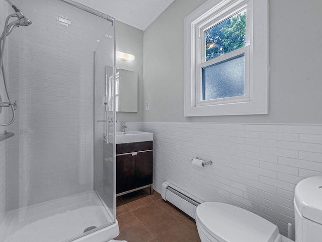 20 Fairmount Blvd, Garden City, NY 11530 - full bathroom featuring a baseboard radiator, a stall shower, tile walls, vanity, and a wainscoted wall