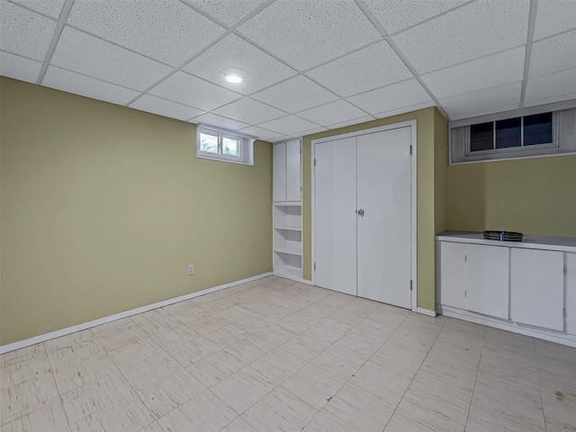 20 Fairmount Blvd, Garden City, NY 11530 - basement featuring a drop ceiling and baseboards